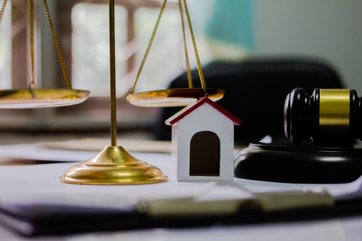 Equipment of the Hammer and Scale law office with contract papers on wood table. Lawyer Concept. Selective Focus